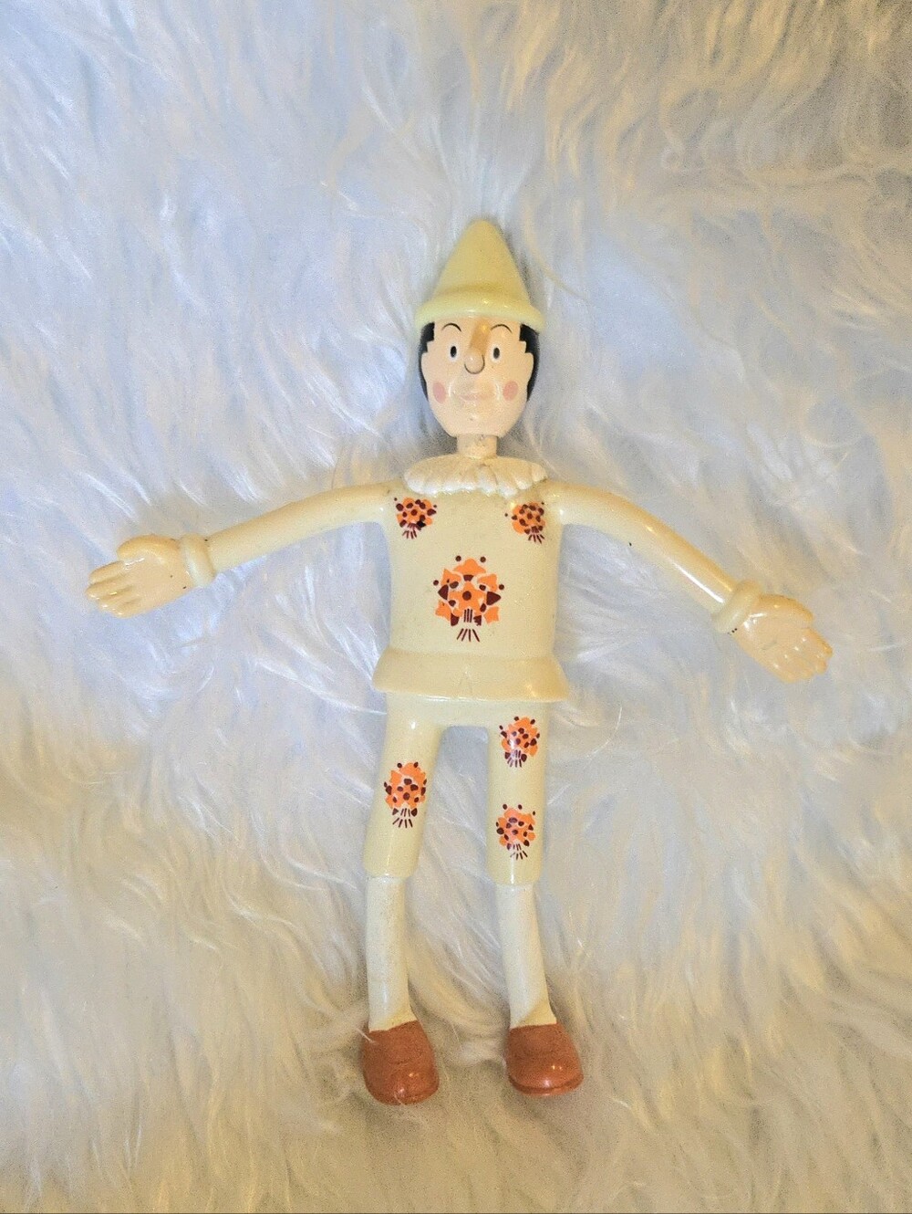 McDonald's 2002 Cream Pinocchio Bendy Figure with Orange Floral Details Vintage